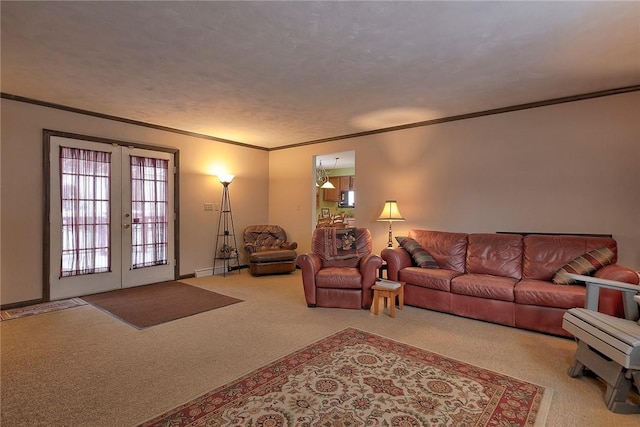 living room featuring french doors, crown molding, and carpet floors