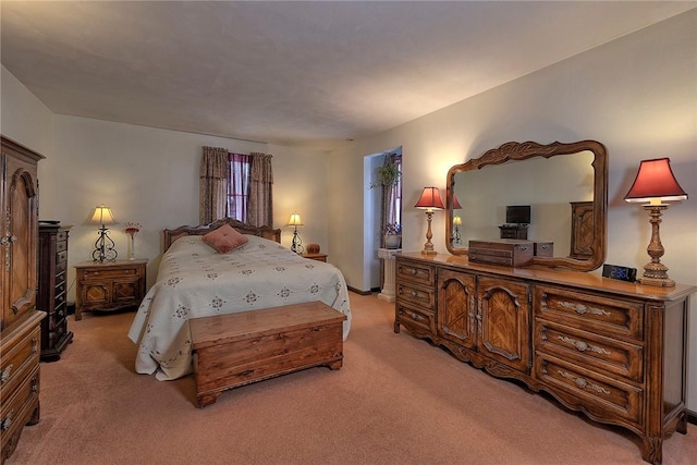 bedroom with light colored carpet