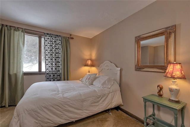 bedroom with baseboards and carpet floors