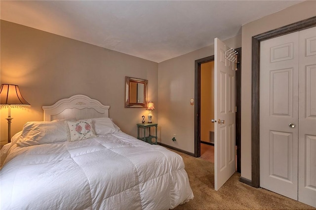 bedroom featuring baseboards and light carpet