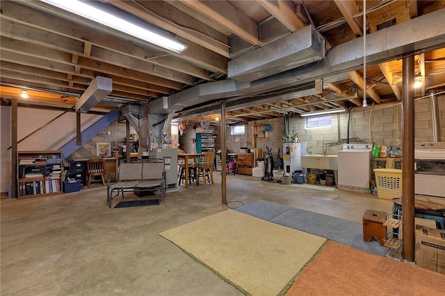 below grade area with electric water heater and heating unit