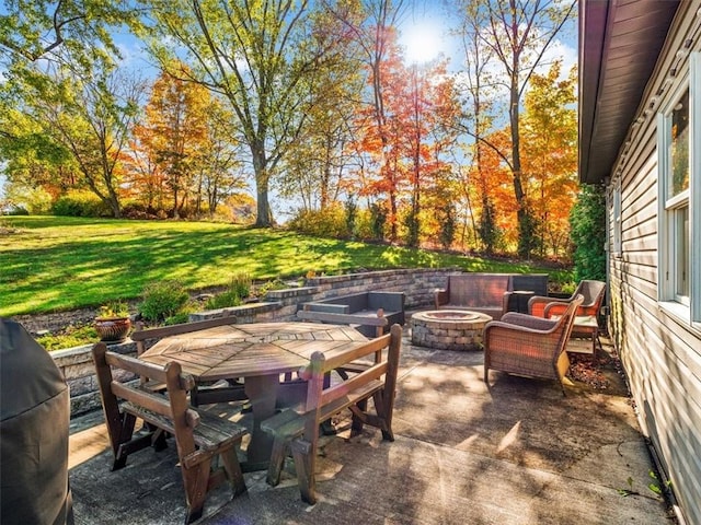 view of patio / terrace featuring an outdoor fire pit