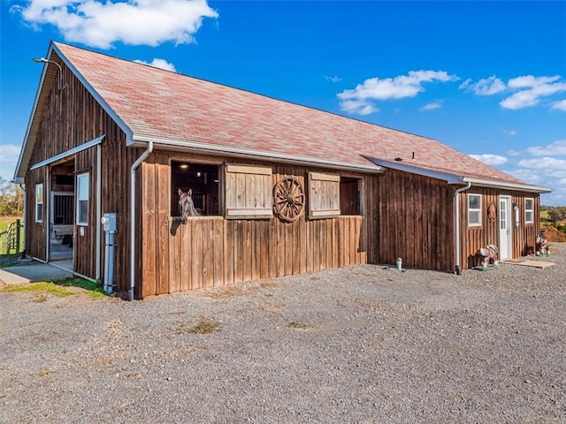 view of home's exterior featuring an outdoor structure and an exterior structure