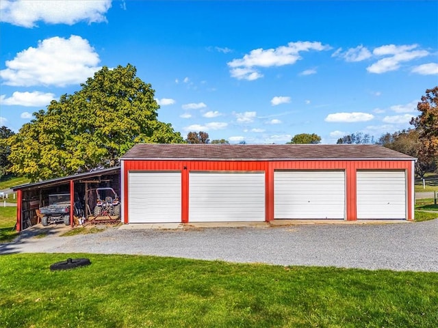 garage with driveway and a garage