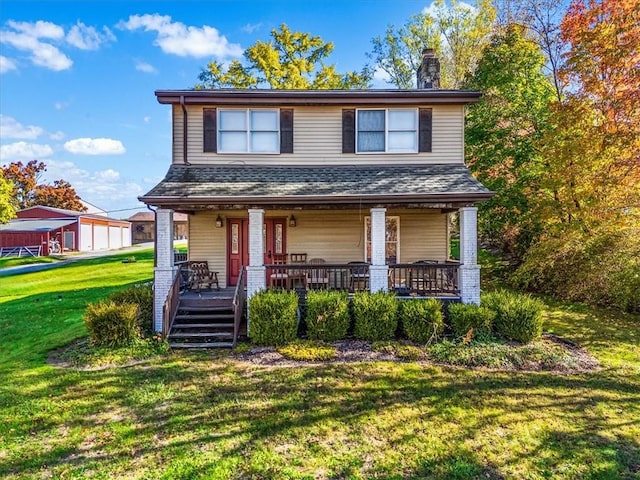view of front of property with a porch, a chimney, and a front yard