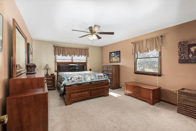 bedroom with light carpet and ceiling fan