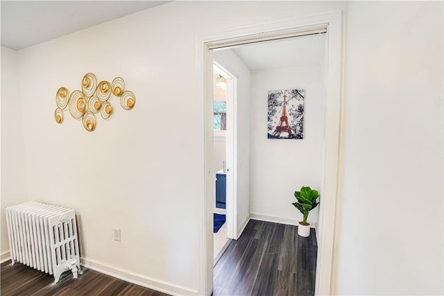 1318 Louise St, Munhall, PA 15120 - hallway featuring dark wood-style floors, baseboards, and radiator heating unit