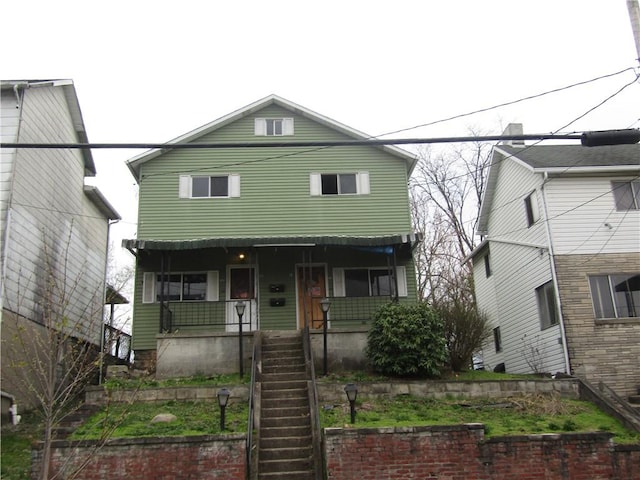 view of front of home featuring a porch and stairway