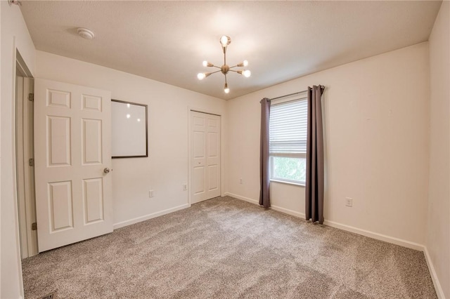 204 Ascot Ct, Moon/Crescent Twp, PA 15108 - unfurnished bedroom with a chandelier, carpet floors, baseboards, and a closet