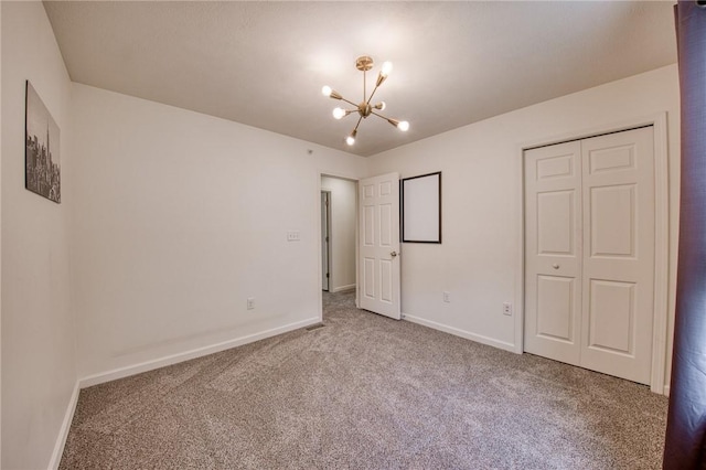 204 Ascot Ct, Moon/Crescent Twp, PA 15108 - unfurnished bedroom featuring carpet flooring, a closet, a chandelier, and baseboards