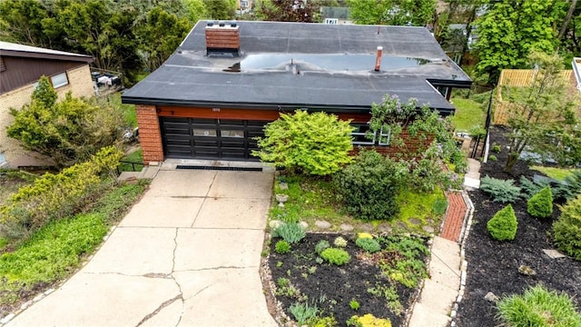 1898 Brushcliff Rd, Churchill Boro, PA 15221 - exterior space featuring brick siding and a garage