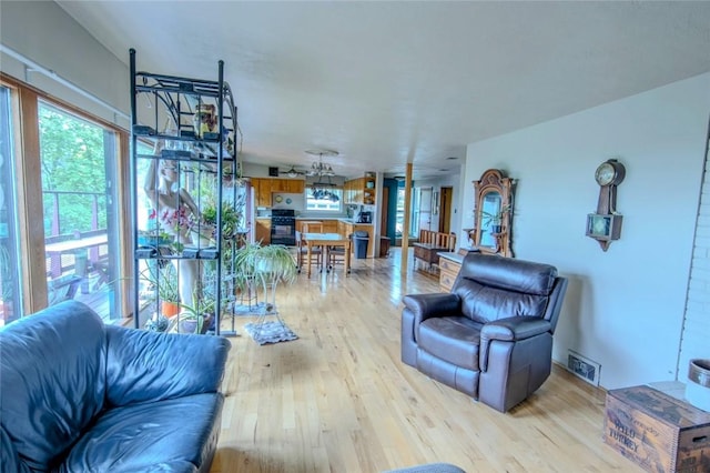 1898 Brushcliff Rd, Churchill Boro, PA 15221 - living area featuring visible vents and wood finished floors