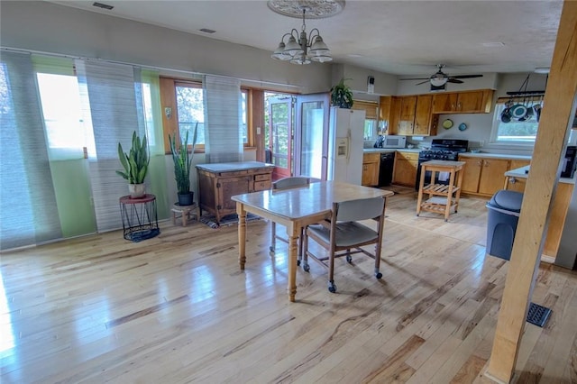 1898 Brushcliff Rd, Churchill Boro, PA 15221 - dining space with light wood finished floors and ceiling fan with notable chandelier