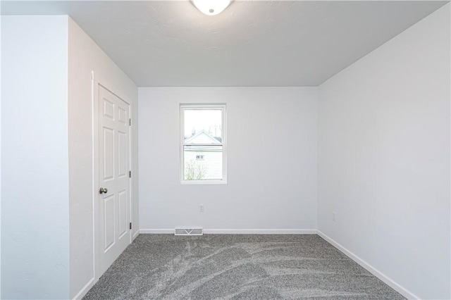 carpeted empty room with baseboards and visible vents