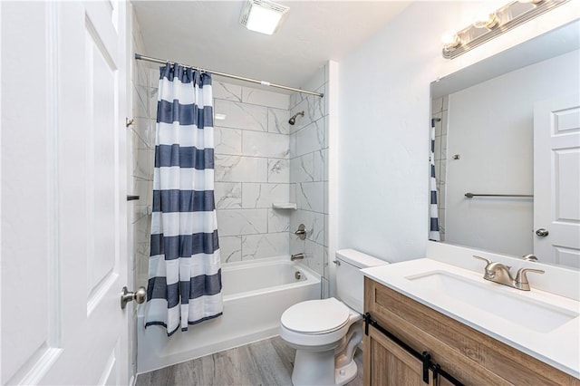 full bath featuring vanity, shower / tub combo with curtain, toilet, and wood finished floors
