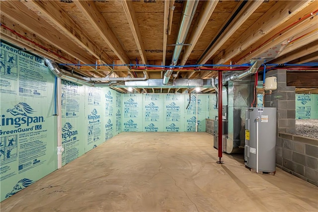 unfinished basement with concrete block wall, electric water heater, and heating unit