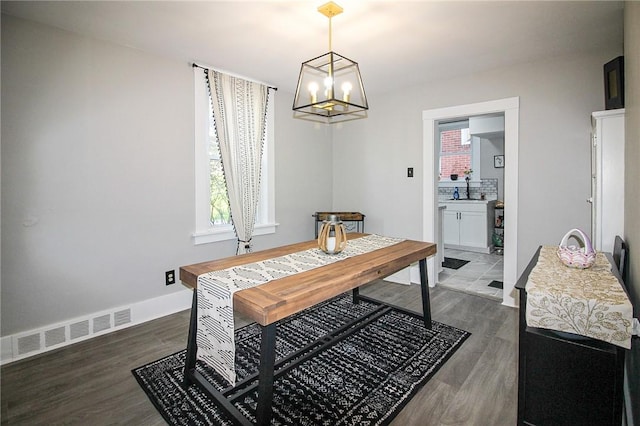 2805 Louisiana Ave, Dormont, PA 15216 - dining room with dark wood-style floors and a chandelier