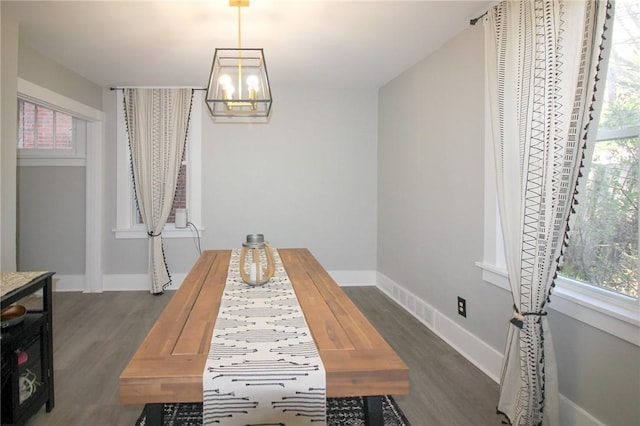 2805 Louisiana Ave, Dormont, PA 15216 - dining area with dark wood-type flooring, a chandelier, and healthy amount of natural light