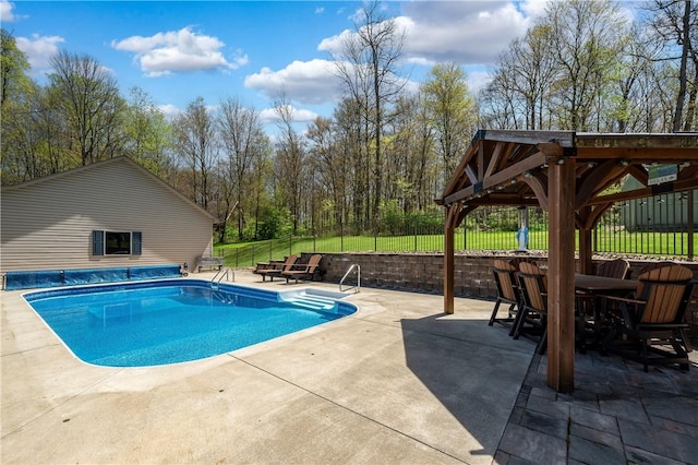 view of swimming pool featuring a gazebo, a patio area, a fenced in pool, and fence