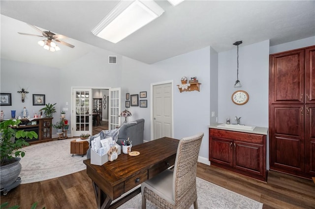 office featuring a sink, french doors, visible vents, ceiling fan, and dark wood-style floors