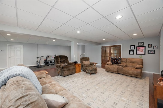 living area featuring baseboards, recessed lighting, and wood finished floors