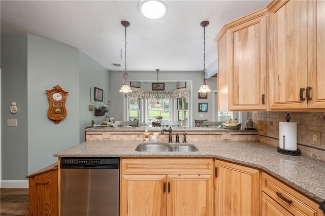 kitchen featuring a sink, stainless steel dishwasher, light brown cabinets, and decorative backsplash