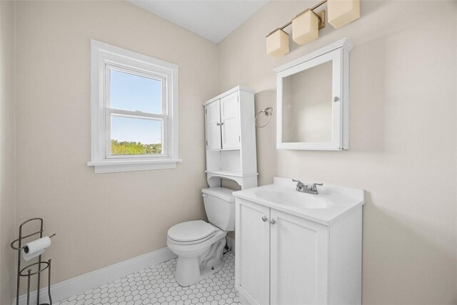 5611 Wickliff St, Lawrenceville, PA 15201 - bathroom featuring toilet, baseboards, and vanity