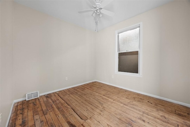 5611 Wickliff St, Lawrenceville, PA 15201 - spare room with baseboards, visible vents, a ceiling fan, and hardwood / wood-style flooring