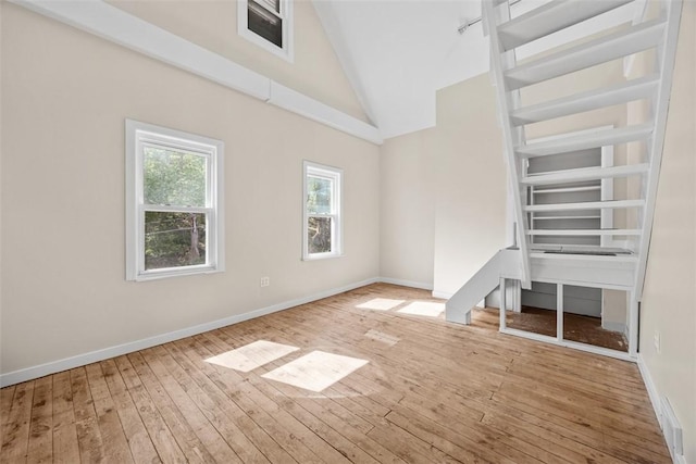 5611 Wickliff St, Lawrenceville, PA 15201 - interior space featuring visible vents, baseboards, hardwood / wood-style floors, and high vaulted ceiling