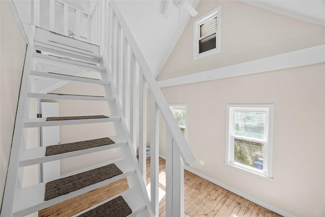 5611 Wickliff St, Lawrenceville, PA 15201 - stairway featuring baseboards, high vaulted ceiling, ceiling fan, and wood finished floors