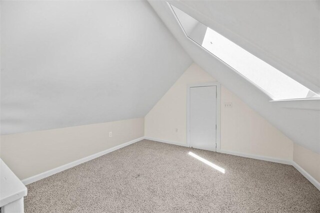5611 Wickliff St, Lawrenceville, PA 15201 - additional living space with baseboards, carpet flooring, and vaulted ceiling with skylight