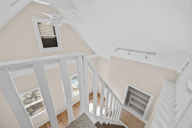 5611 Wickliff St, Lawrenceville, PA 15201 - staircase featuring lofted ceiling, a wealth of natural light, a ceiling fan, and track lighting