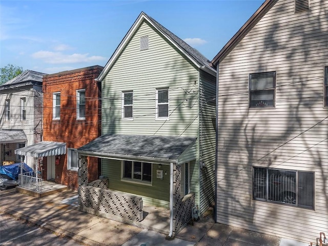5611 Wickliff St, Lawrenceville, PA 15201 - back of house with a porch and roof with shingles