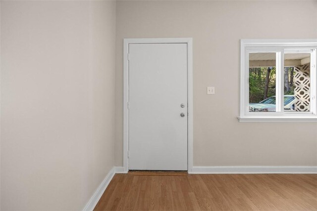 5611 Wickliff St, Lawrenceville, PA 15201 - doorway featuring wood finished floors and baseboards