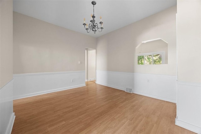 5611 Wickliff St, Lawrenceville, PA 15201 - spare room featuring an inviting chandelier, light wood finished floors, baseboards, and visible vents