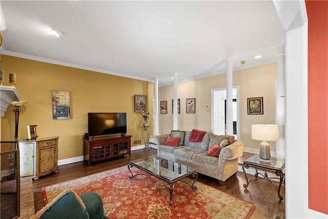 living room featuring wood finished floors, ornate columns, crown molding, baseboards, and recessed lighting
