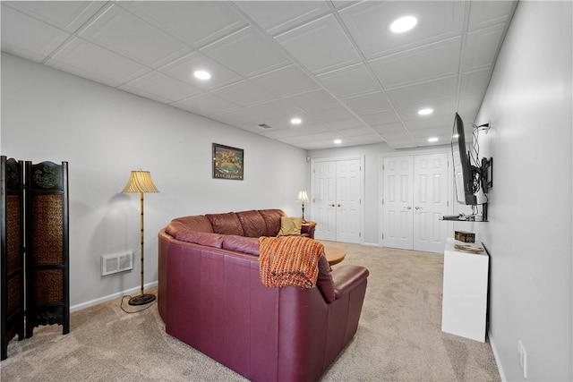 living room featuring light carpet, baseboards, visible vents, and recessed lighting