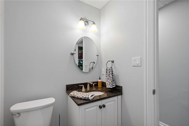 bathroom with toilet and vanity