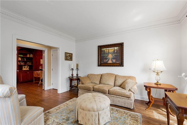 living area featuring baseboards, crown molding, and wood finished floors