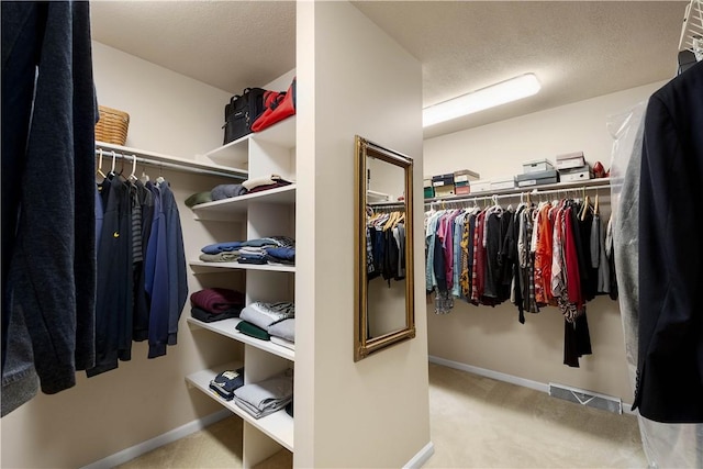 spacious closet with visible vents and carpet floors