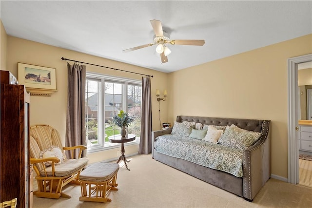 carpeted bedroom featuring baseboards and ceiling fan