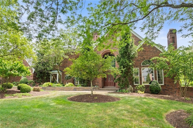 1609 Blackburn Heights Dr, Franklin Park, PA 15143 - view of front of property with a front lawn, brick siding, and a chimney