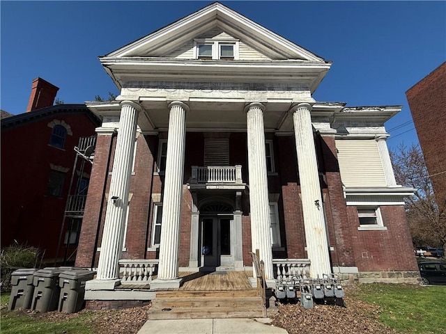 2345 Perrysville Ave, Perry Hilltop, PA 15214 - neoclassical / greek revival house with a balcony, a porch, and brick siding