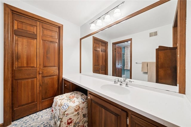 bathroom featuring vanity and visible vents