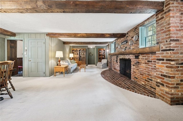 living room with carpet flooring, a brick fireplace, beamed ceiling, and wooden walls