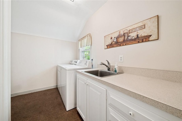 laundry room with baseboards, washer and dryer, a sink, dark carpet, and cabinet space