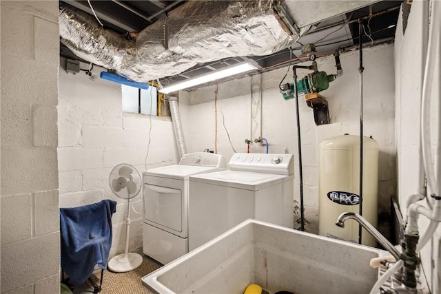 laundry room featuring a sink, laundry area, and washer and dryer