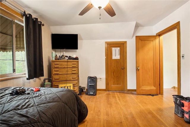 bedroom with light wood-type flooring and ceiling fan