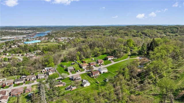 aerial view with a wooded view and a residential view