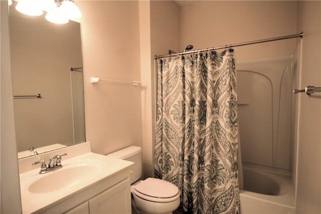bathroom featuring vanity, toilet, and shower / bathtub combination with curtain